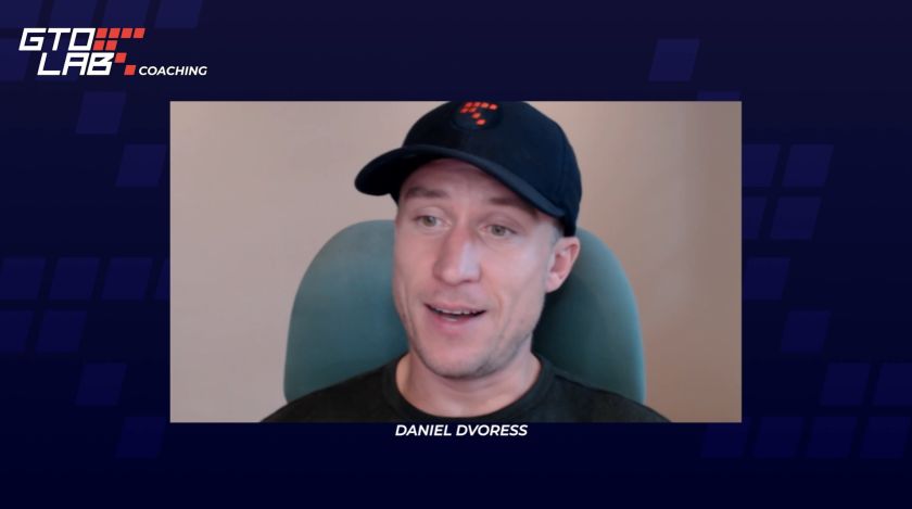 Daniel Dvoress speaking during a GTO LAB coaching session, wearing a black cap and seated in front of a neutral background.