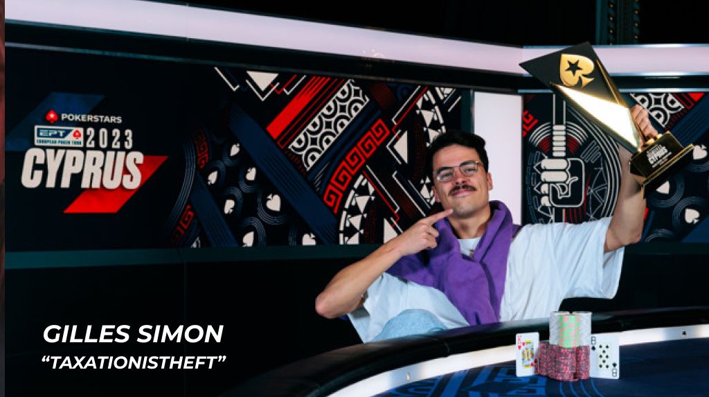 Gilles Simon holding a poker trophy and pointing to the trophy after winning the EPT Cyprus 2023 Main Event.