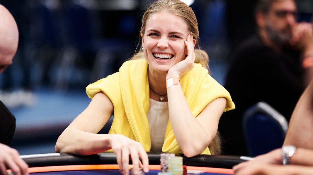 Diana Kalietina smiling at the poker table during a live event.
